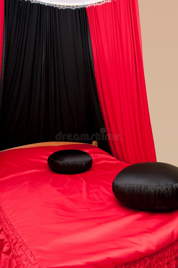 Stylish Red Bed with Black Pillows Stock Image Image of design