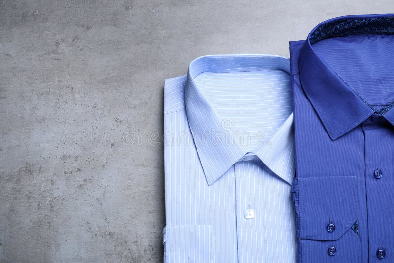 Stylish Shirts on Background, Flat Lay. Drycleaning Service Stock