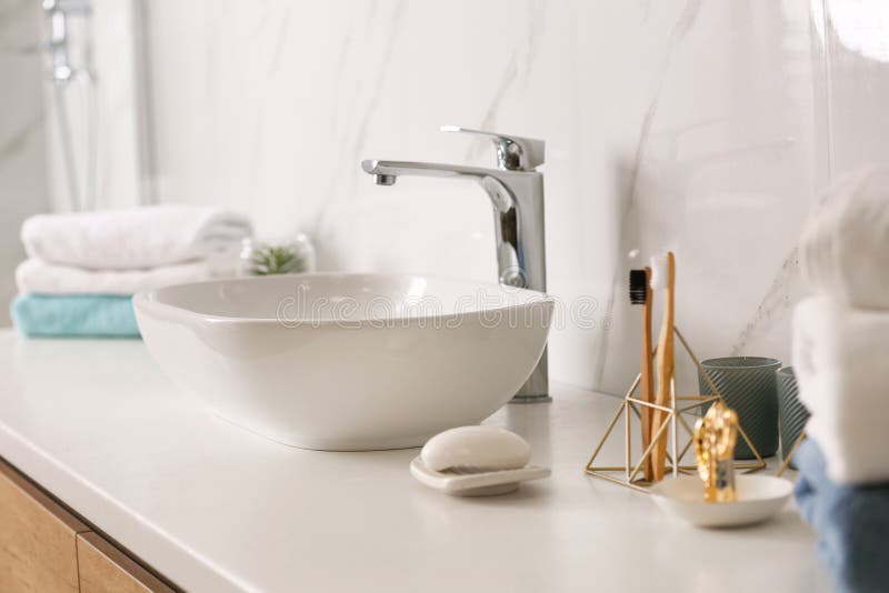 Stylish Vessel Sink on Light Countertop in Modern Bathroom Stock Photo