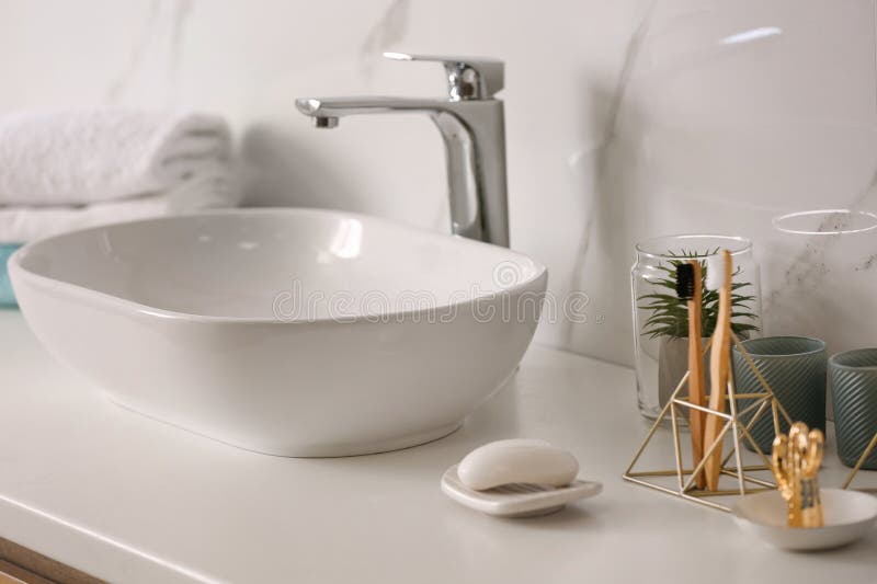 Stylish Vessel Sink on Light Countertop in Modern Bathroom Stock Photo