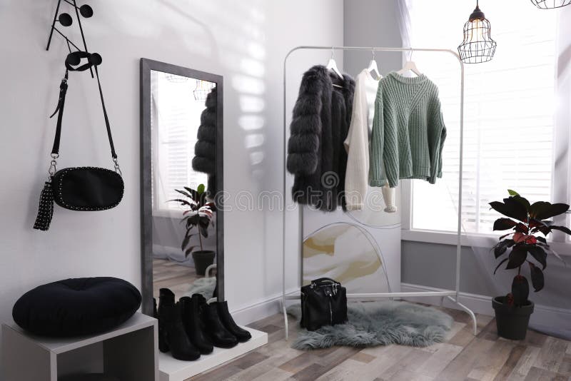 Stylish Warm Clothes on Rack in Dressing Room Interior Stock Photo Image of fall, clothing