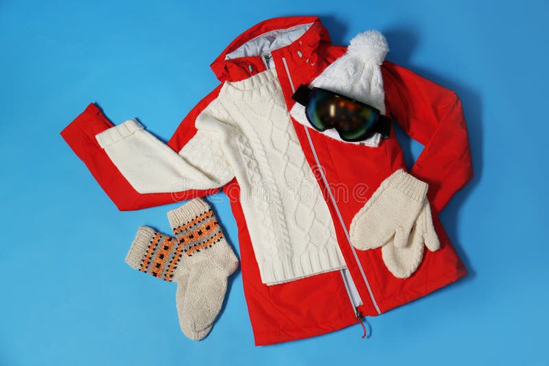 Stylish Winter Sport Clothes on Light Blue Background, Flat Lay Stock