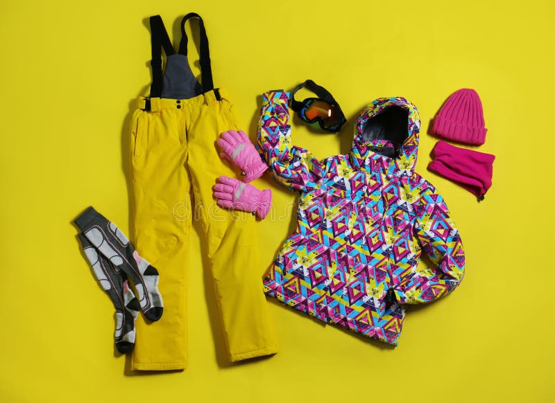 Stylish Winter Sport Clothes on Yellow Background, Flat Lay Stock Photo