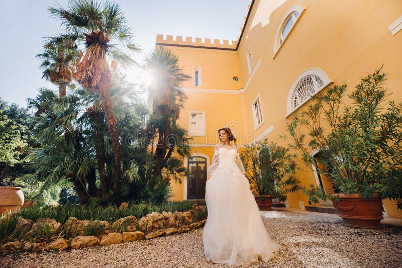 Stylish young bride on her wedding day in Italy.elegant Bride from Tuscany.Bride in a white wedding dress