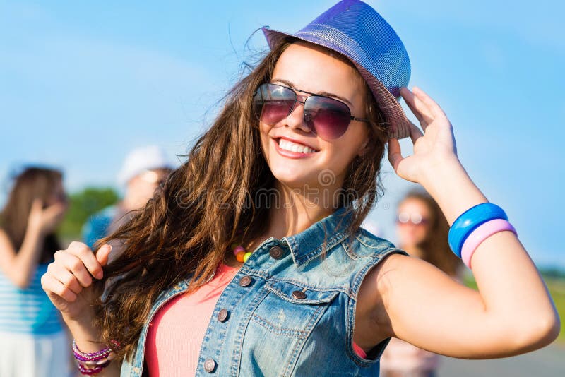 Stylish young woman in sunglasses