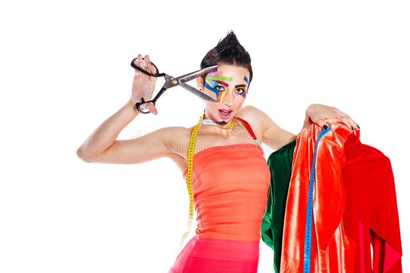Stylist with face art holds a pair of scissors and dummy. Stylist Girl with face art for Halloween. The girl is holding a pair of scissors, at her neck royalty free stock photo Stylist with face art holds a pair of scissors and dummy. Stylist Girl with face art for Halloween. The girl is holding a pair of scissors, at her neck royalty free stock photo