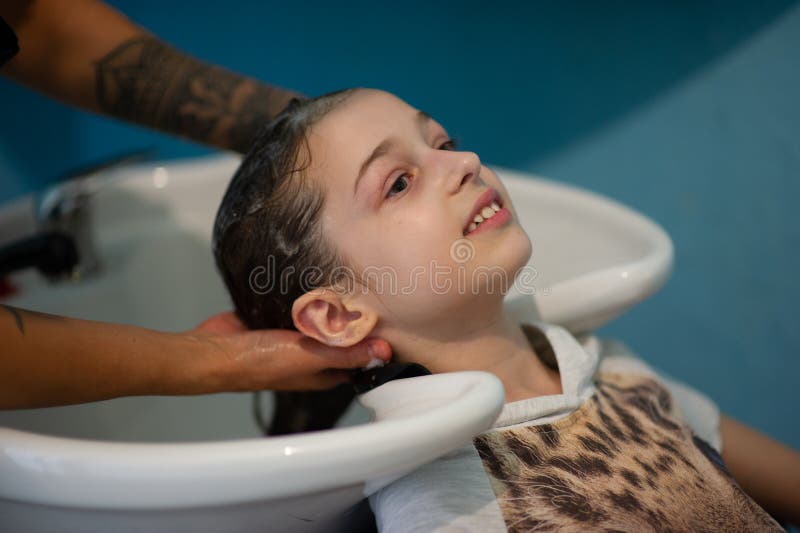 Stylist Hairdresser Makes a Hairstyle for a Cute Little Girl in a Beauty  Salon. Hairdressing, Hair Cutting Stock Photo - Image of head, hairdo:  158048052