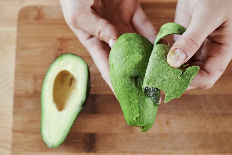 A hand holding a green wooden cutting board. High quality photo. A hand holding a green wooden cutting board. High quality photo