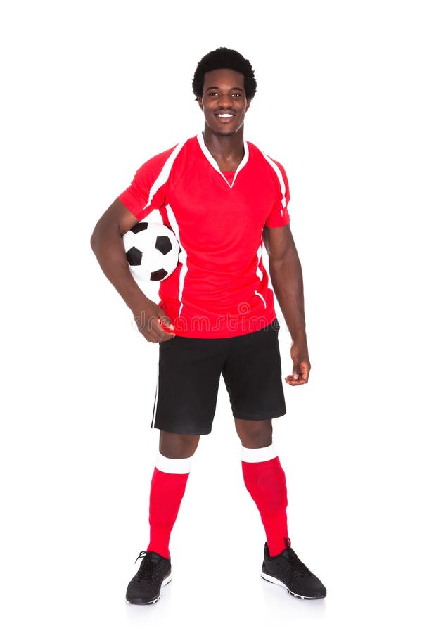 Stående av den lyckliga fotbollspelaren arkivfoto Stående av den lyckliga fotbollspelaren arkivfoto