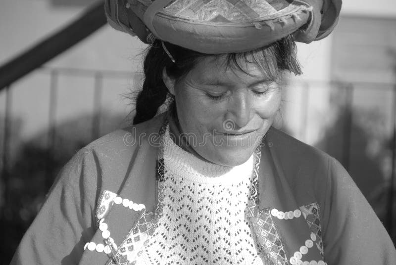 AREQUIPA PERU NOVEMBER 27:Portrait of peruvian Indian Woman in Traditional Dress Weaving alpaca wool on november 27 2010 in Arequipa Peru. The national poverty rate is over 50 per cent. AREQUIPA PERU NOVEMBER 27:Portrait of peruvian Indian Woman in Traditional Dress Weaving alpaca wool on november 27 2010 in Arequipa Peru. The national poverty rate is over 50 per cent.