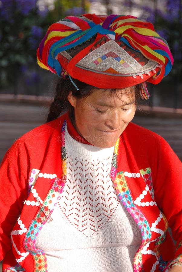 AREQUIPA PERU NOVEMBER 27:Portrait of peruvian Indian Woman in Traditional Dress Weaving alpaca wool on november 27 2010 in Arequipa Peru. The national poverty rate is over 50 per cent. AREQUIPA PERU NOVEMBER 27:Portrait of peruvian Indian Woman in Traditional Dress Weaving alpaca wool on november 27 2010 in Arequipa Peru. The national poverty rate is over 50 per cent.