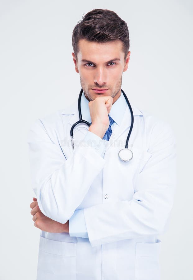 Stående av en eftertänksam manlig doktor som ser kameran royaltyfri fotografi Stående av en eftertänksam manlig doktor som ser kameran royaltyfri fotografi