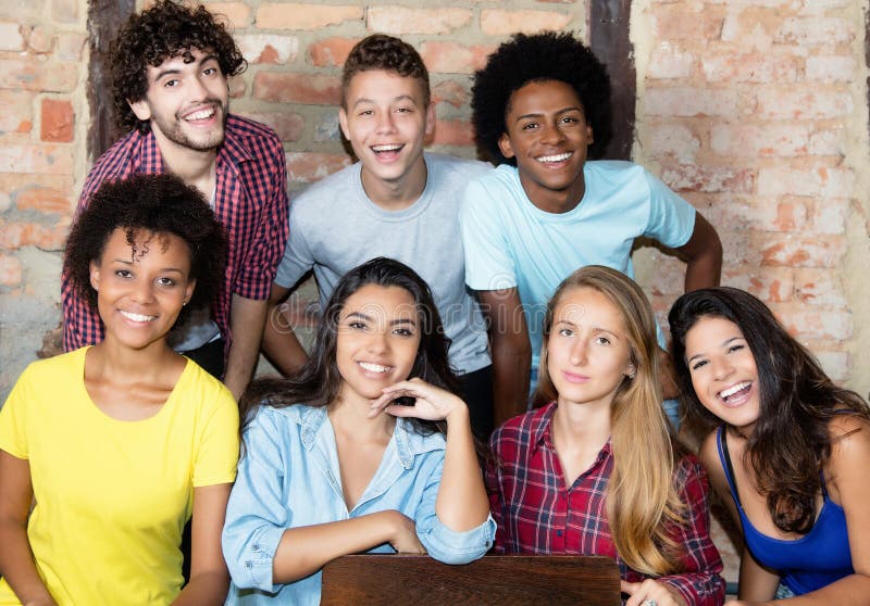 Portrait of group of multi ethnic american young adult people looking at camera. Portrait of group of multi ethnic american young adult people looking at camera