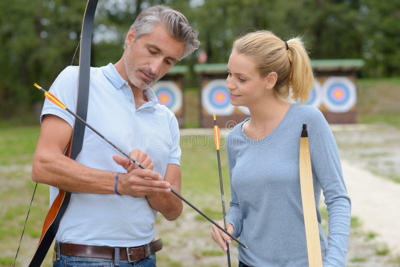 portrait of couple doing the fletching. portrait of couple doing the fletching