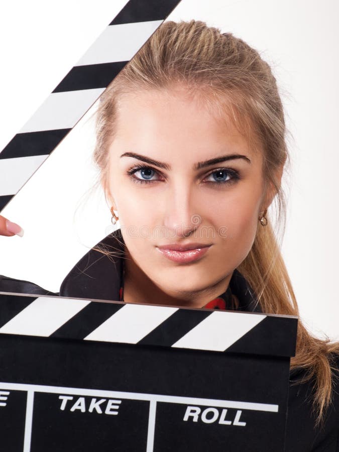 Portrait of beautiful girl with film slate in studio on white background. Portrait of beautiful girl with film slate in studio on white background