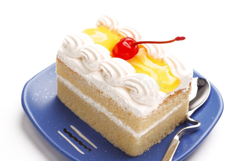 Piece of lemon jelly cake with cherry on top ,on white background. Piece of lemon jelly cake with cherry on top ,on white background