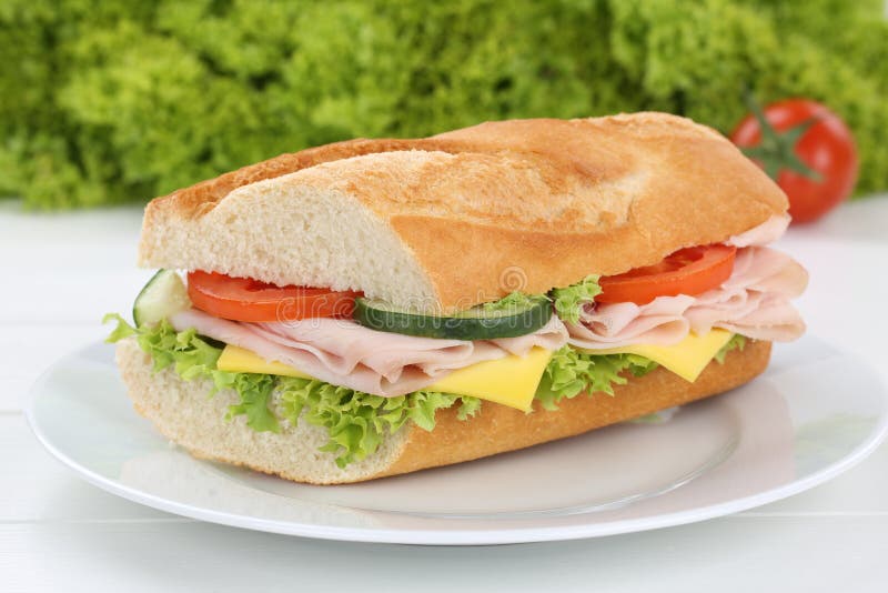 Sub Sandwich Baguette on Plate with Ham for Breakfast Stock Photo