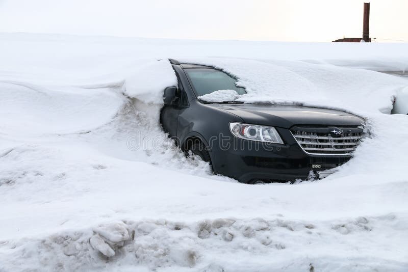 Novyy Urengoy, Russia - April 2, 2020: Black car Subaru Tribeca covered with snow