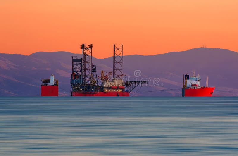 A cargo ship loaded with a juck-up rig. A cargo ship loaded with a juck-up rig