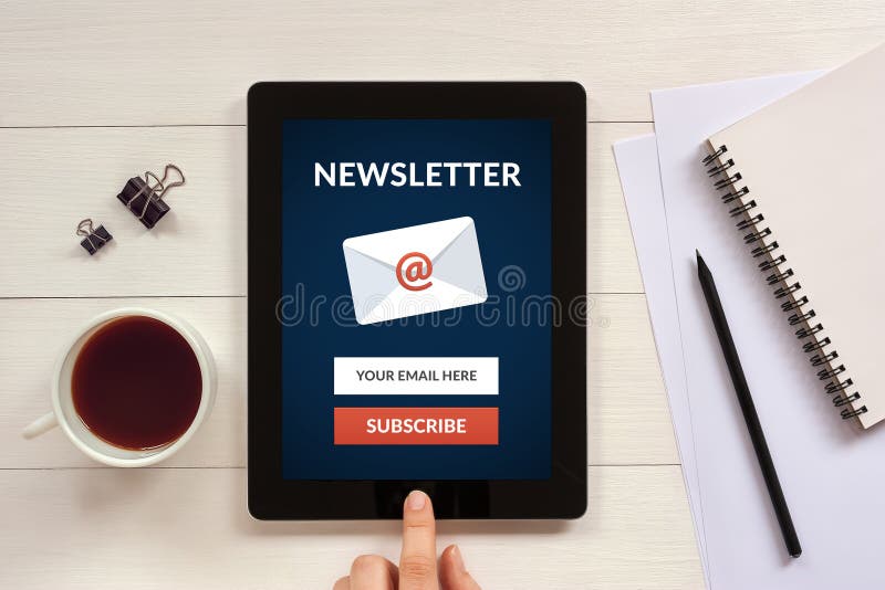 Subscribe newsletter concept on tablet screen with office object. S on white wooden table. All screen content is designed by me. Flat lay Subscribe newsletter concept on tablet screen with office object. S on white wooden table. All screen content is designed by me. Flat lay