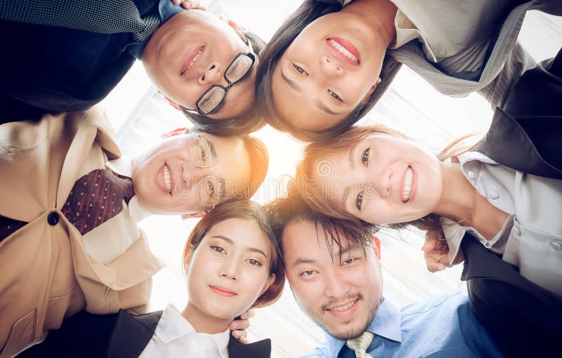 Success business team ,Businesspeople putting heads togeth stock photo Success business team ,Businesspeople putting heads togeth stock photo