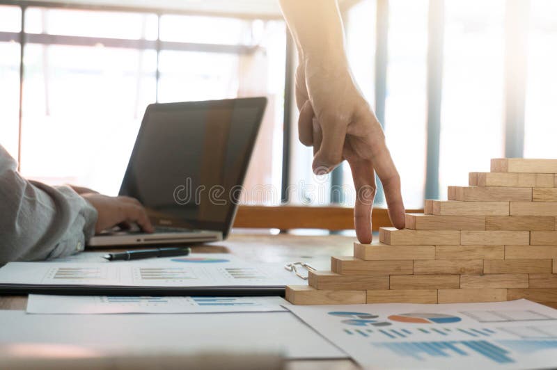 Success concept with business woman hand climbing wooden block s stock photos Success concept with business woman hand climbing wooden block s stock photos