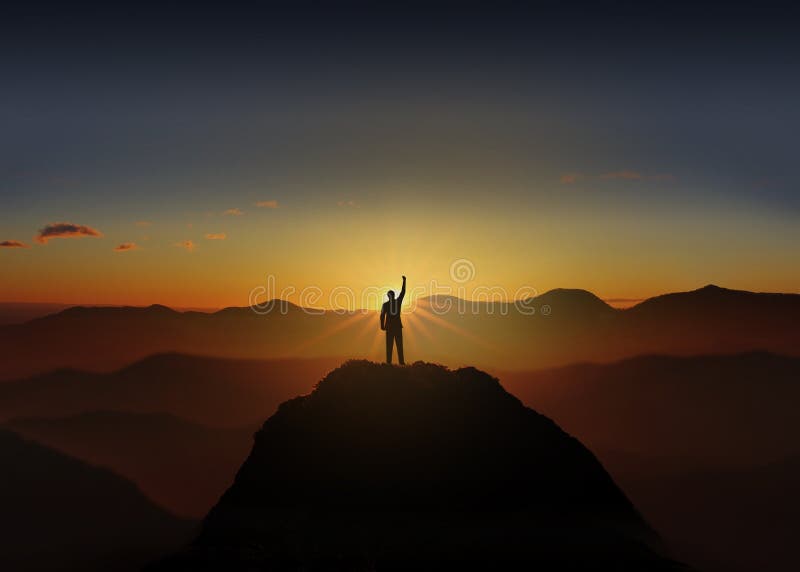 .Success Concept. Silhouette of business man are celebrating success on top mountain