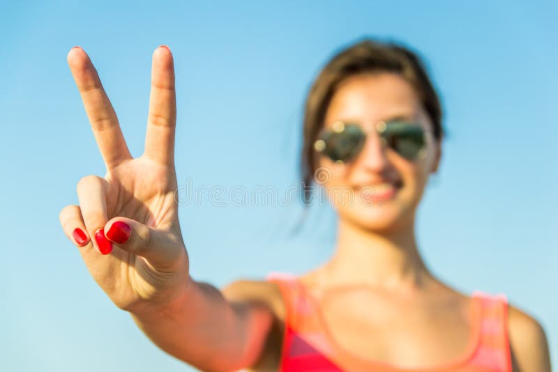 Beautiful Girl Showing The Victory Sign. Beautiful Girl Showing The Victory Sign