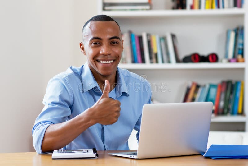 Successful african american man at computer