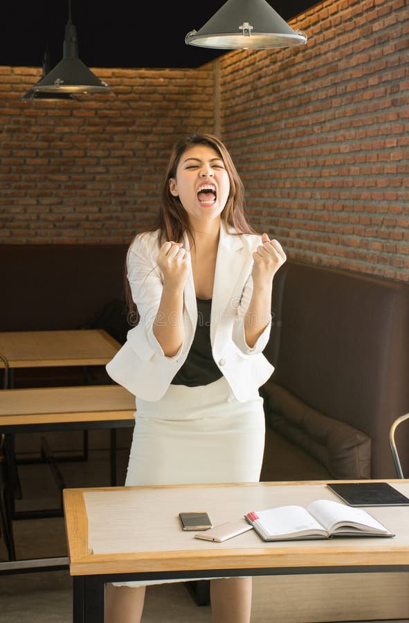 Successful Asian business woman with arms up stock photography Successful Asian business woman with arms up stock photography