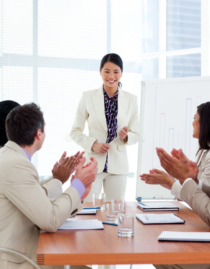 Successful asian woman giving a presentation stock photos Successful asian woman giving a presentation stock photos