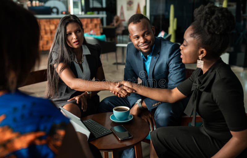 Successful black South african businesswoman interview applicant shaking hands with human resources manager