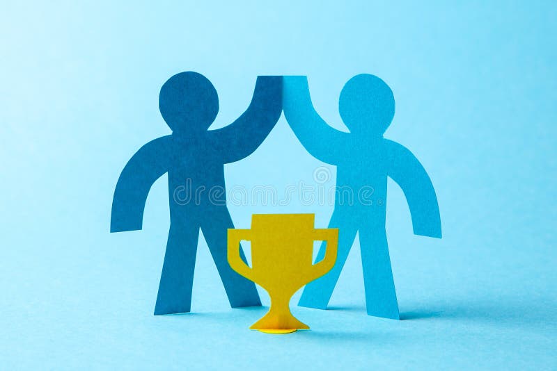 Successful Business Team Winner Holds Gold Cup in His Hands. Team