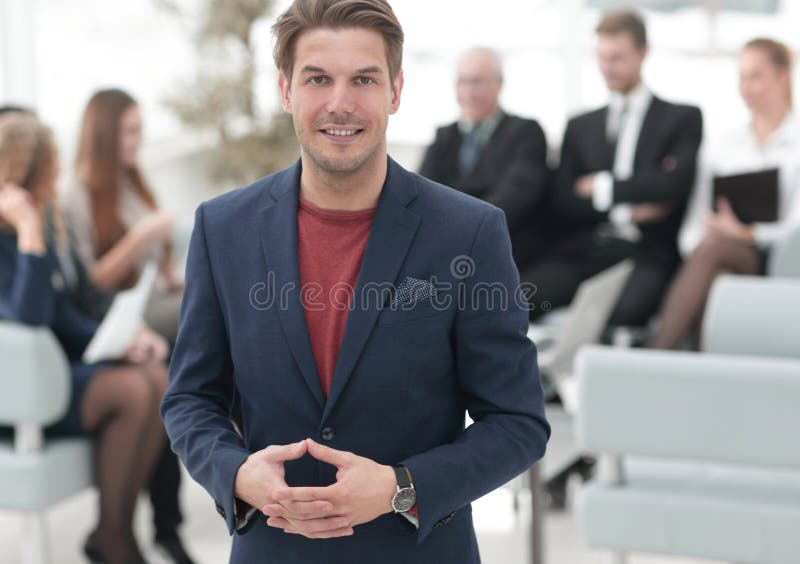 Successful businessman on blurred background business team.