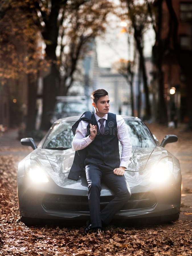 Successful Businessman Posing with Luxury Sports Car Holding the Jacket ...