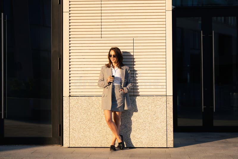 Successful businesswoman standing over modern office background, startup and business concept. royalty free stock image Successful businesswoman standing over modern office background, startup and business concept. royalty free stock image