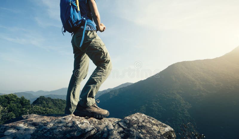 Backpacker enjoy the view cliff edge royalty free stock image