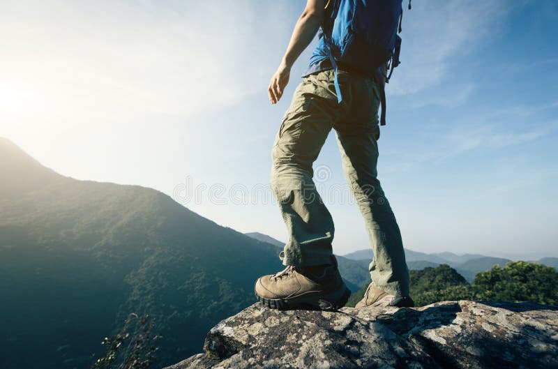Backpacker enjoy the view cliff edge royalty free stock images
