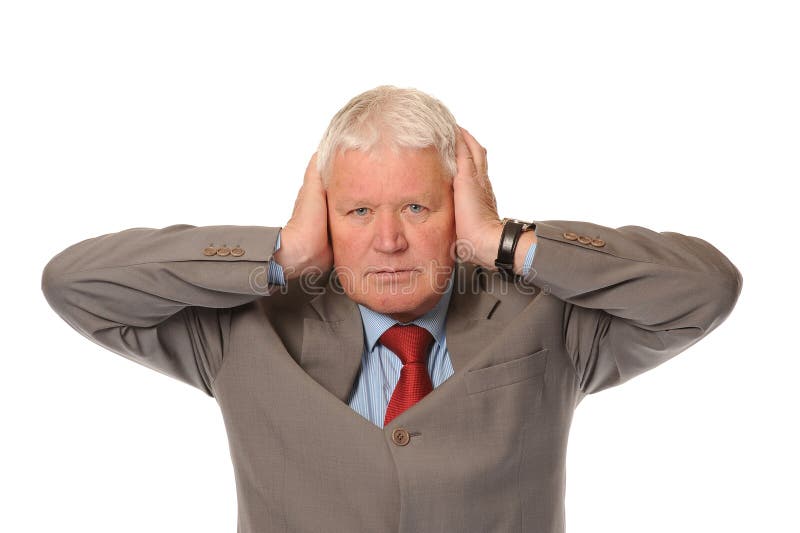 Successful mature businessman covering ears