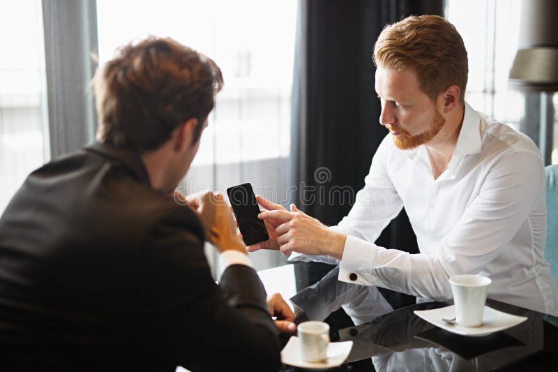 Successful project, two business people in formalwear discussing in cafe. stock photos