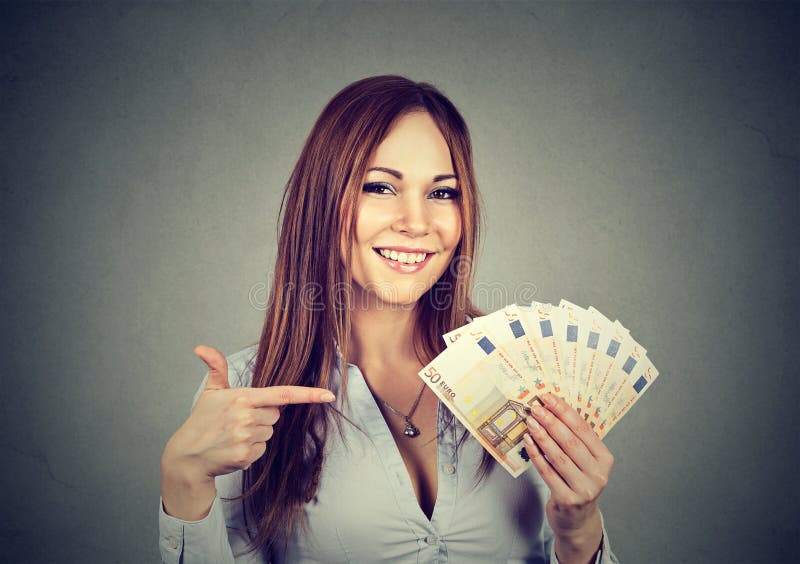 Successful young business woman holding money euro bills in hand royalty free stock images Successful young business woman holding money euro bills in hand royalty free stock images