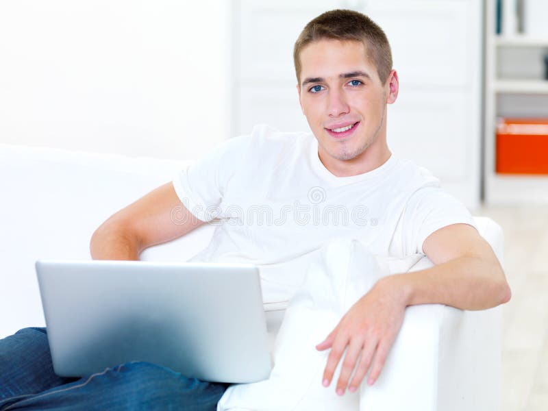 Successful young man with laptop