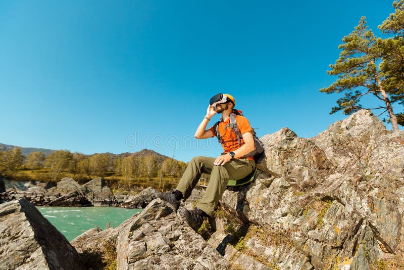 Successful Young Man, Using Virtual Reality Goggles To Tour in