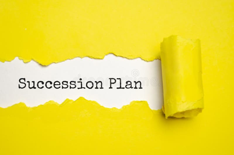 SUCCESSION PLAN text on torn paper , yellow background royalty free stock photography