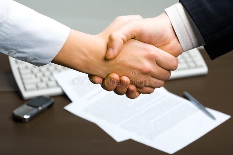 Successful deal: people shaking hands at business meeting. Successful deal: people shaking hands at business meeting
