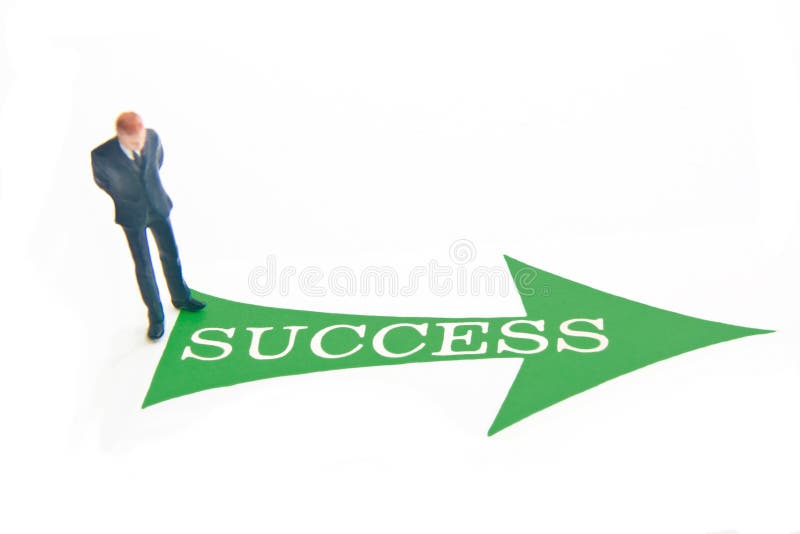 Miniature business man with green arrow and SUCCESS text. Miniature business man with green arrow and SUCCESS text.