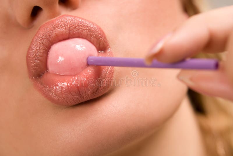 Sucking pink lollipop