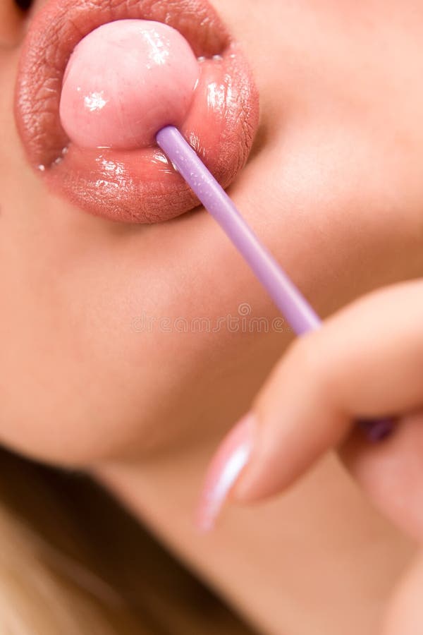 Sucking pink lollipop