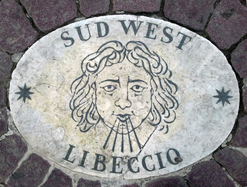 Sud West. South West - a head symbolizing the direction of the wind. An ancient image on a marble slab in St. Peter`s Square in th. E Vatican. Europe. Italy stock image Sud West. South West - a head symbolizing the direction of the wind. An ancient image on a marble slab in St. Peter`s Square in th. E Vatican. Europe. Italy stock image