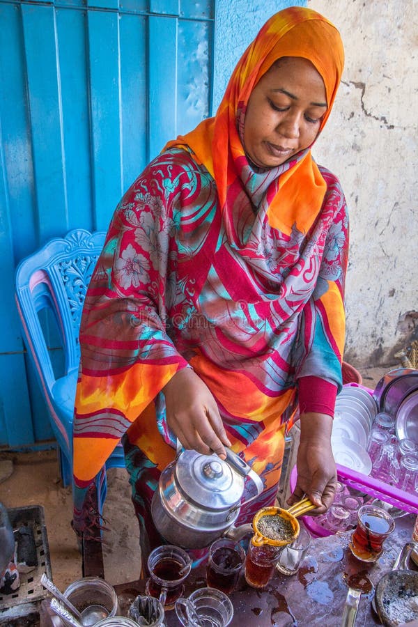 Sudanese woman pouring tea. royalty free stock photos Sudanese woman pouring tea. royalty free stock photos